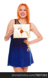 Christmas x-mas winter or valentine&#39;s day, birthday concept - red hair girl holding golden gift box studio shot isolated