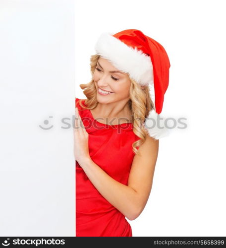 christmas, xmas, holidays and advertisement concept - happy asian woman in santa helper hat with blank white board
