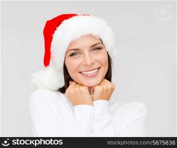 christmas, xmas, winter, happiness concept - smiling woman in santa helper hat