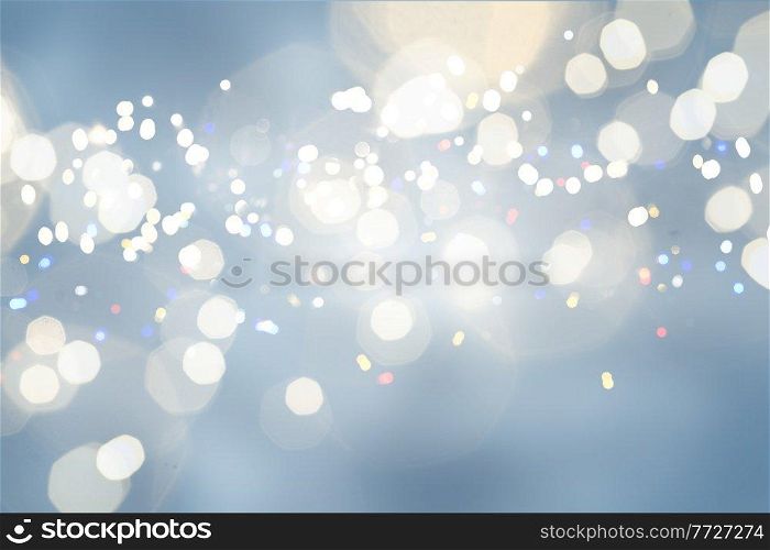 christmas yellow lights bokeh defocused blue background. christmas lights defocused background