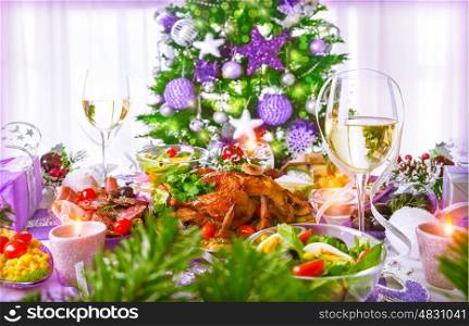 Christmastime dinner with backed chicken, various of dish and traditional Christmas drink, champagne, New Year eve concept&#xA;
