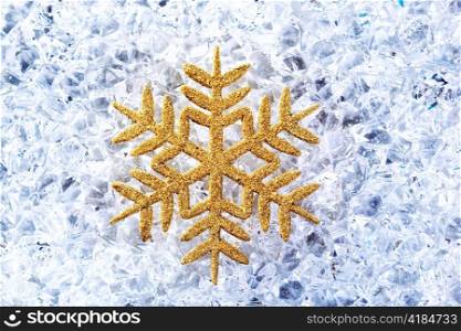 chritmas golden snowflake symbol on winter ice
