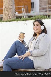 chubby girl enjoying coffee outdoors 6