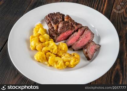 Chuck eye beef steak with curried cauliflower