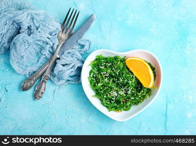 Chuka Seaweed Salad in ceramic bowl, chuka salad and sauce