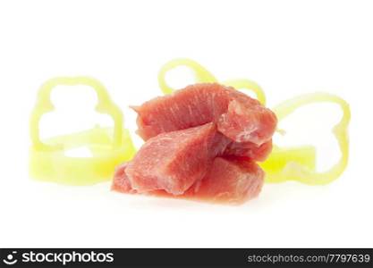 chunks of fresh meat and pepper isolated on white