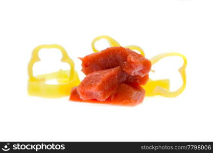 chunks of raw meat and pepper isolated on white