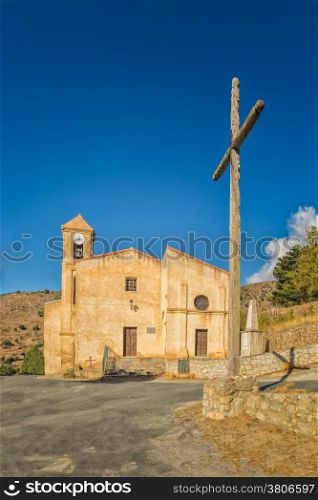 Church and croass at Costa near Corscia in central Corsica