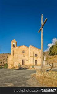 Church and croass at Costa near Corscia in central Corsica