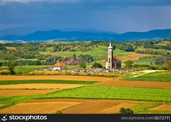 Church and graveyard on picturesque landscape, region of Prigorje, Croatia