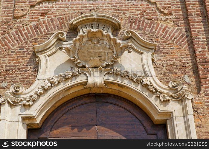 church door in italy lombardy column the milano old closed brick