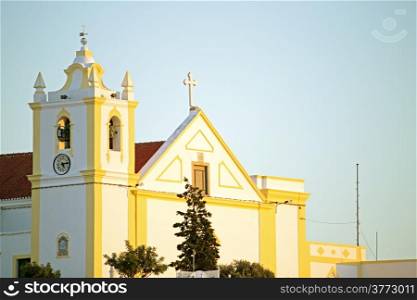 Church from Ferrragudo at sunset in Portugal