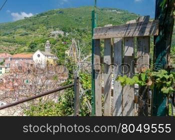 Church, Monastery of St. Francis, colorful facades of the old houses in the village Vernazza. Cinque Terre National Park, Liguria, Italy.