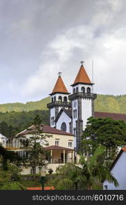 Church of Nossa Senhora da Alegria in Furnas with cloudy sky, Azores&#xA;