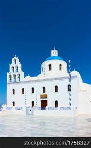 Church of Panagia Platsani in Oia in Santorini Island against the blue sky, Greece. Greek architecture