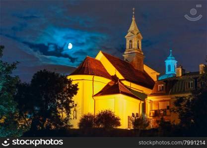 Church of Saint Benson in New Town of Warsaw at moonlit night, Warsaw Old town, Poland.