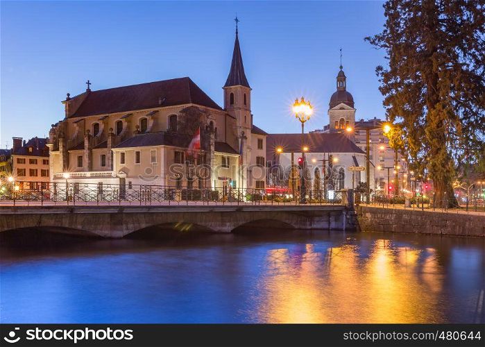 Church of Saint Francois de Sales and Thiou river during morning blue hour in old city of Annecy, Venice of the Alps, France. Annecy, called Venice of the Alps, France