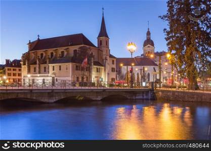 Church of Saint Francois de Sales and Thiou river during morning blue hour in old city of Annecy, Venice of the Alps, France. Annecy, called Venice of the Alps, France