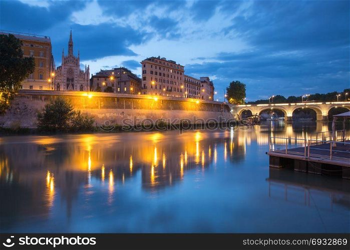 Church of the Sacred Heart in Prati, Rome, Italy. Tiber riverside with Church of the Sacred Heart of Jesus in Prati and mirror reflection during evening blue hour in Rome, Italy