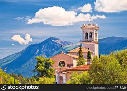 Church on idyllic green hill above Garda lake, Lombardy, Italy