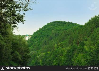 Church on mountain in an environment of a wood. Svyatogorsk laurels. Ukraine