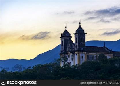 Church on top of the mountain at sunset of the historic city of Ouro Preto in Minas Gerais. Church on top of the mountain at sunset of  Ouro Preto
