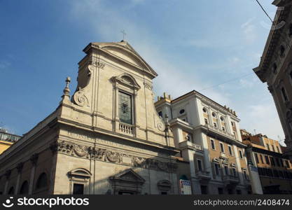 Church Santa Maria in Via in Rome, Italy . Fasade was designed by Giacomo della Porta and completed by Carlo Rainaldi .. Church Santa Maria in Via in Rome, Italy . Fasade was designed by Giacomo della Porta and completed by Carlo Rainaldi.