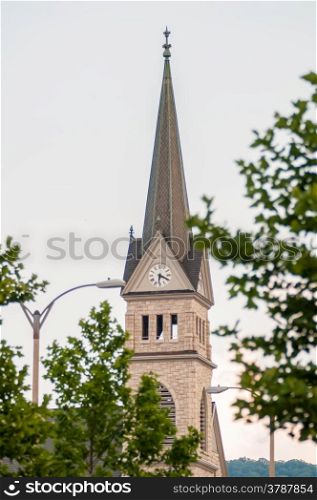 church steeple seen in a city