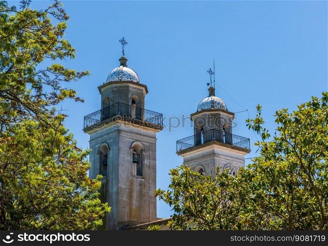 Church towers above the trees in Colonia del Sacramento Uruguay. Church towers in Unesco historical town of Colonia del Sacramento