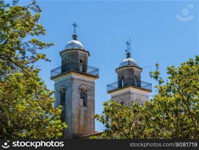 Church towers above the trees in Colonia del Sacramento Uruguay. Church towers in Unesco historical town of Colonia del Sacramento