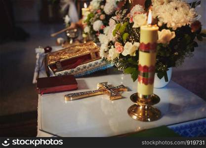 Church utensil, wedding crowns on an altar, cross and the Bible on table ceremony. Church utensil, wedding crowns on an altar, cross and the Bible on table ceremony. religious items