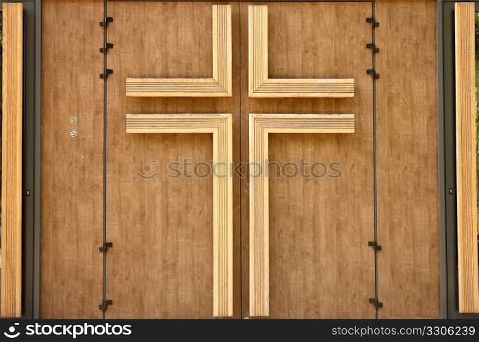 Church wooden door with crucifix