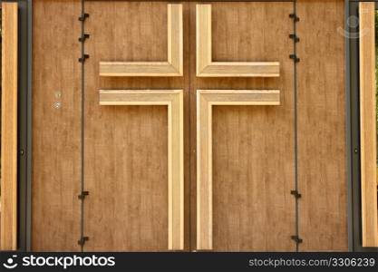 Church wooden door with crucifix