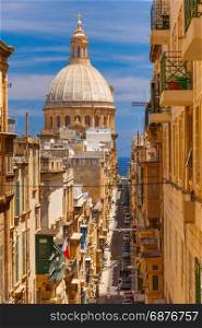 Churche of Our Lady of Mount Carmel, Valletta. Dome of churche of Our Lady of Mount Carmel and narrow street of Valletta, Capital city of Malta