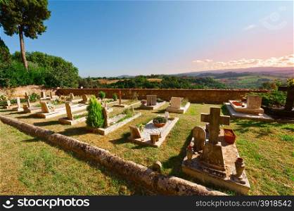 Churchyard on the Background of the Tuscan Landscape at Sunset