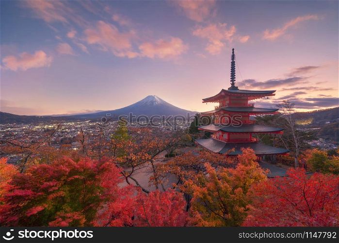 Chureito Pagoda Temple with red maple leaves or fall foliage in autumn season. Colorful trees, Fujiyoshida, Japan. Nature landscape background.