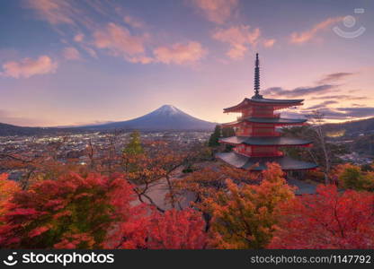 Chureito Pagoda Temple with red maple leaves or fall foliage in autumn season. Colorful trees, Fujiyoshida, Japan. Nature landscape background.