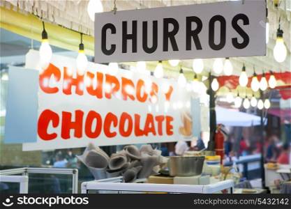Churros and chocolate fritter typical food in Valencia Fallas fest at spain