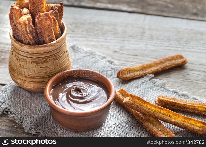 Churros - famous Spanish dessert with chocolate sauce