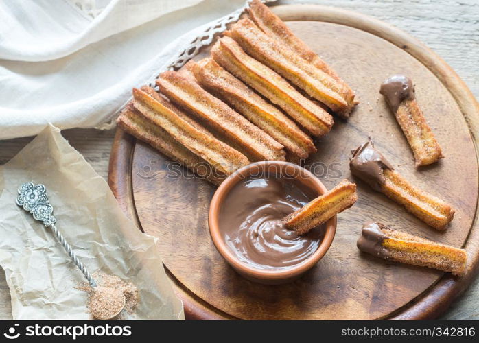 Churros - famous Spanish dessert with chocolate sauce