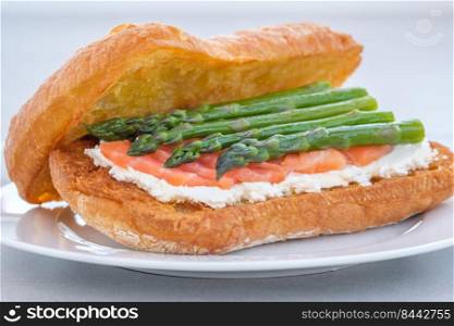 Ciabatta sandwich with cream cheese, salmon and asparagus