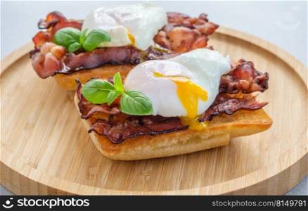 Ciabatta sandwich with poached egg and bacon