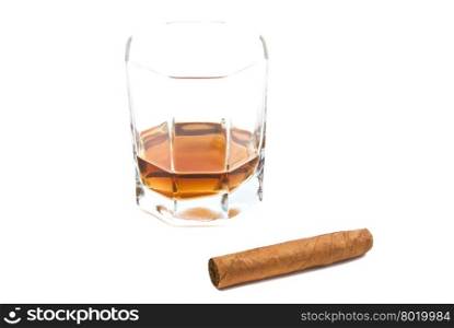 cigar and glass of cognac on white
