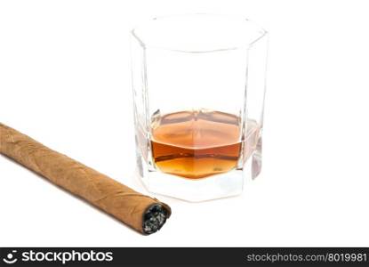 cigar and glass of cognac on white closeup