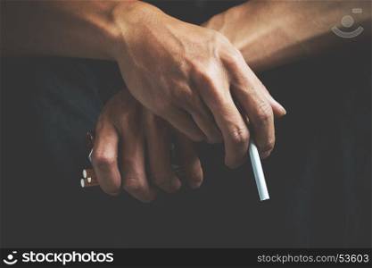 Cigarette addiction. Tobacco nicotine smoke. Unhealthy, danger, bad, narcotic habit. White filter. Health risk, cancer illness. Quit, stop toxic drug. Lifestyle concept. Pack in hand