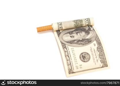 Cigarette and one hundred dollar bill on white background