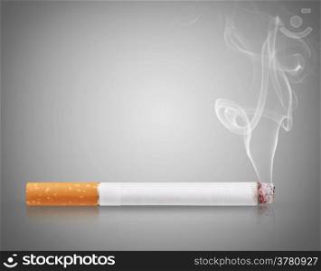 Cigarette burns on gray background
