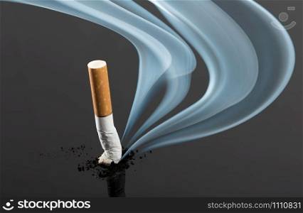 Cigarette butt with curve fume on gray