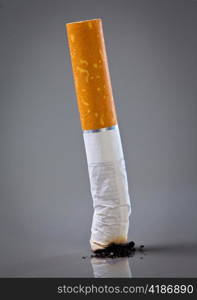 cigarette end on a grey background