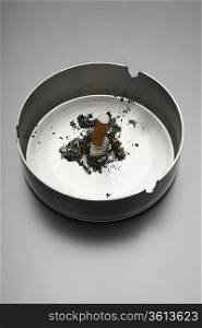 Cigarette in ashtray
